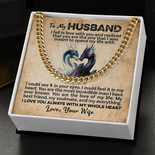 A link chain in gold color placed on a box with a message from a wife to a husband.