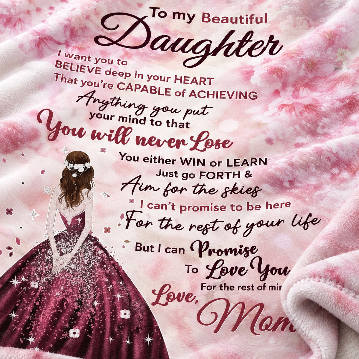 Close-up of the To My Beautiful Daughter Win or Learn message on soft pink fleece blanket from Mom